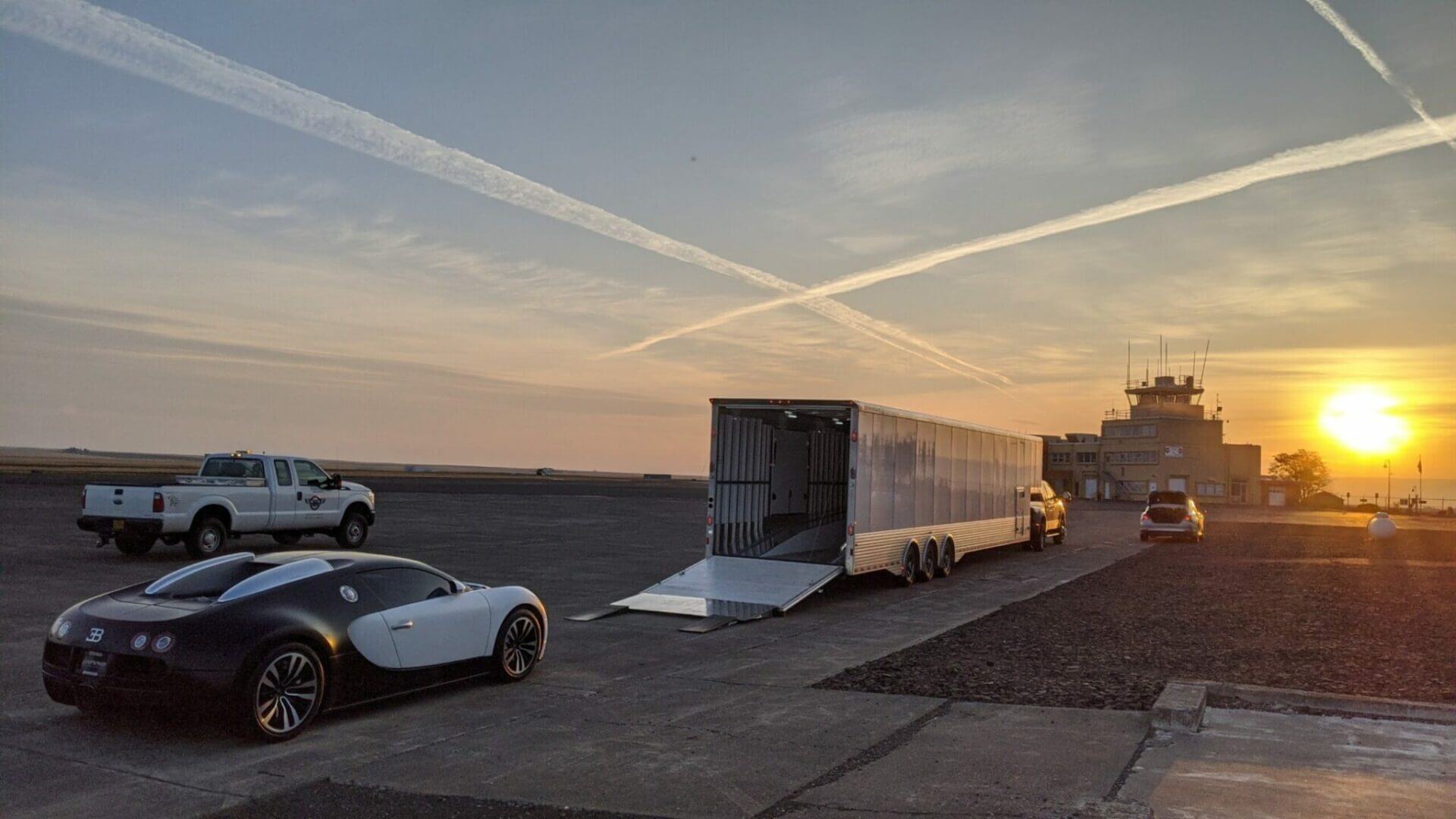 Bugatti Being Loaded into Enclosed Trailer During Sunset | National Transport Services