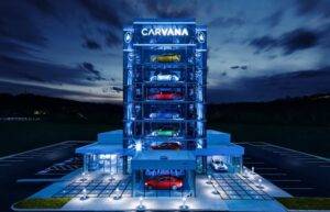 Used Car Websites image of a Carvana car vending machine at night