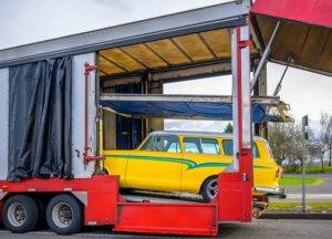 Vintage yellow car in private carrier trailer