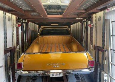 The Back Side of a Gold Chevrolet El Camino SS in Enclosed Trailer | National Transport Services
