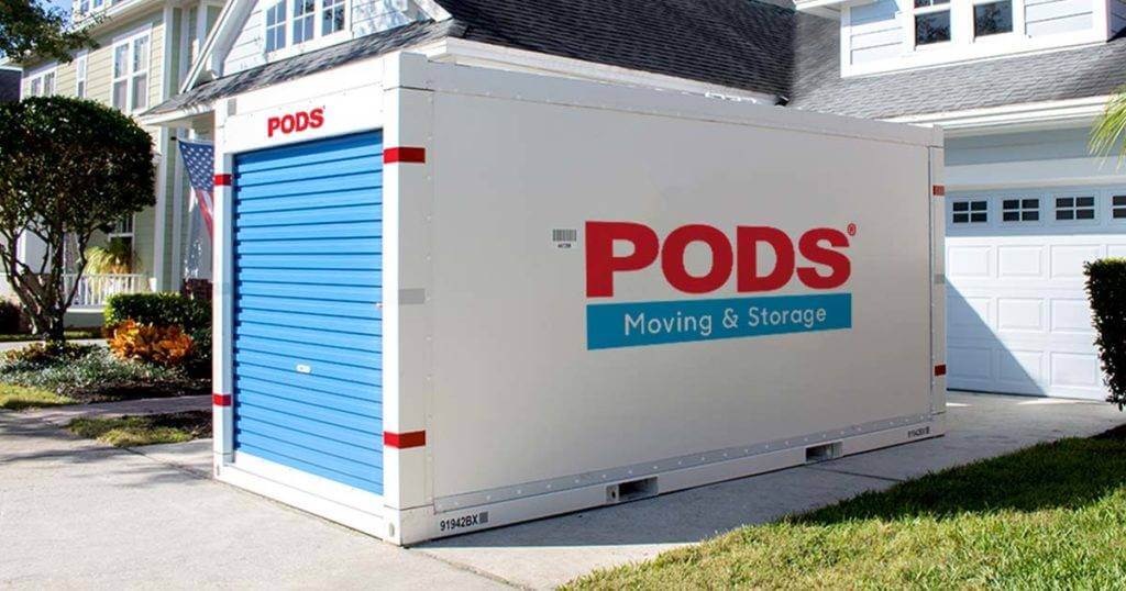 PODS container in the driveway of a home. . Moving Pod Storage.