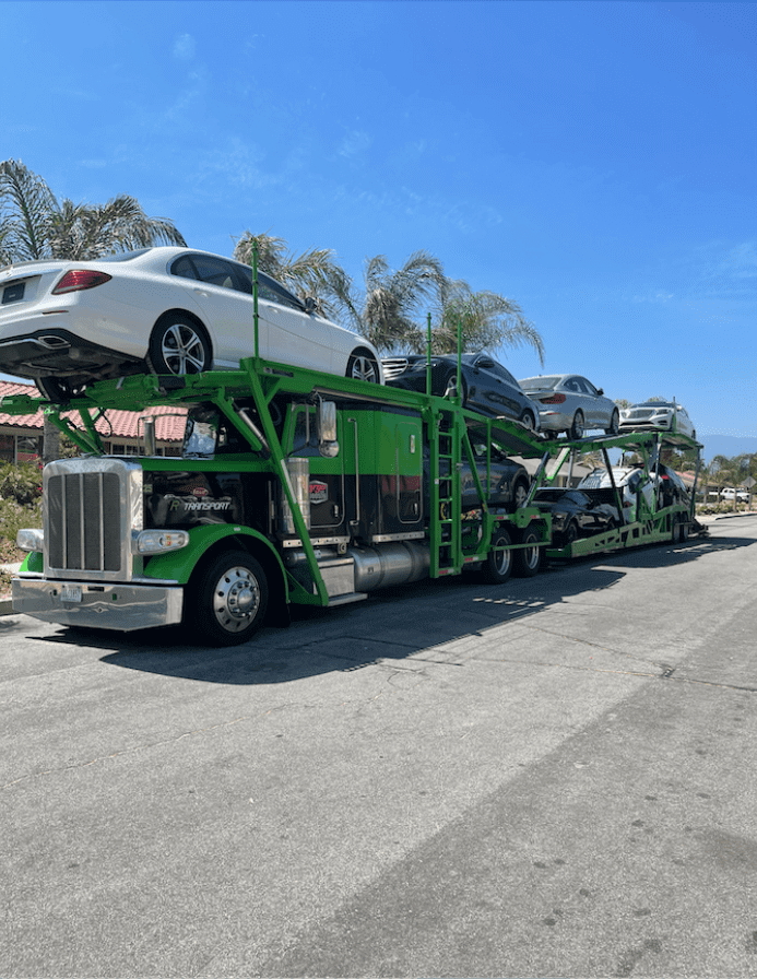 Open car transport with a fully loaded trailer. NTS can access thousands of open and enclosed transport as a car transport company.
