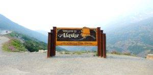 A welcome to Alaska sign. National Transport Services ship vehicles to and from Alaska. We are Alaska car transport experts.