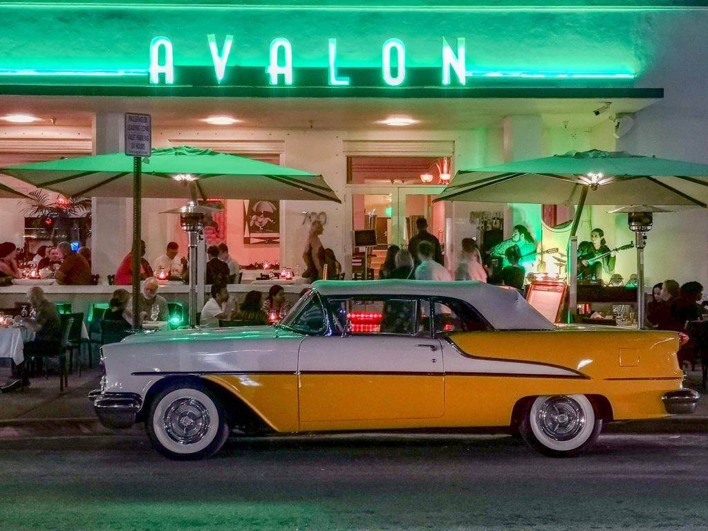 1950s classic convertible parked in front of the restaurant Avalon in Miami, FL. We are the #1 Florida auto transport company.