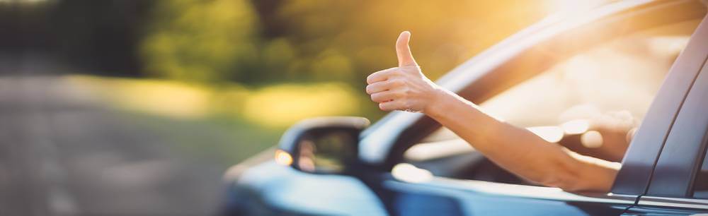 Driver giving a thumbs up out the car window. The best car shipping company: National Transport Services will help you ship a car anywhere in the United States. Choose NTS, one of the most reliable car shipping companies in the nation.